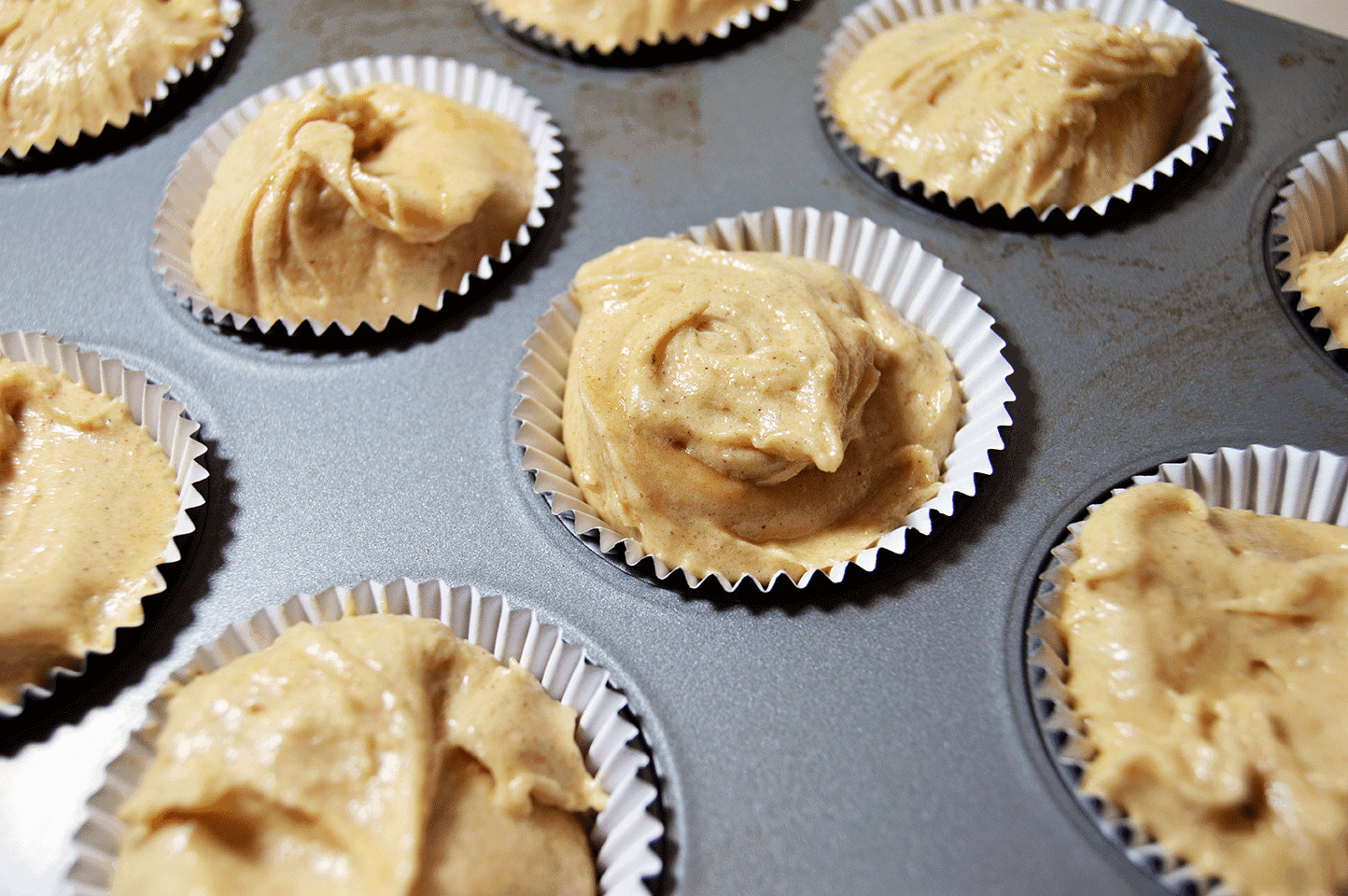 cupcake batter in tin 