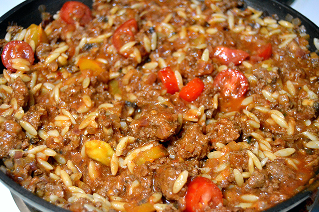 orzo in skillet with bison filling