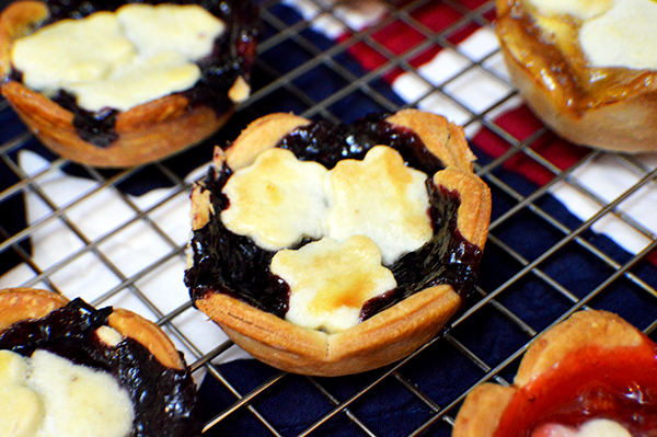 mini blueberry pie on cooling rack