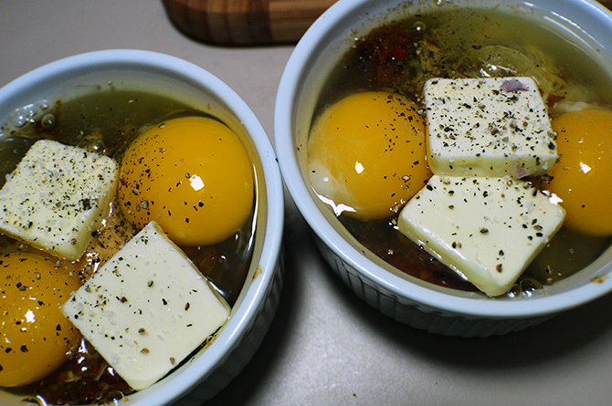 butter on eggs in ramekins