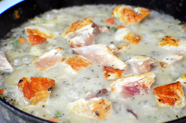 chicken pieces simmering