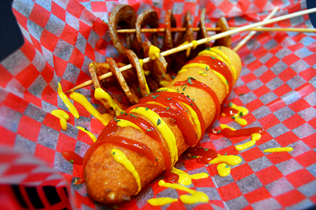 corndog with ketchup and mustard