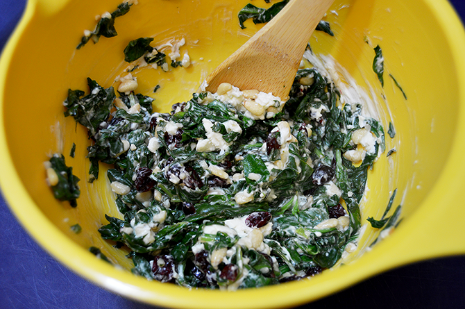 mixing spinach with cream cheese