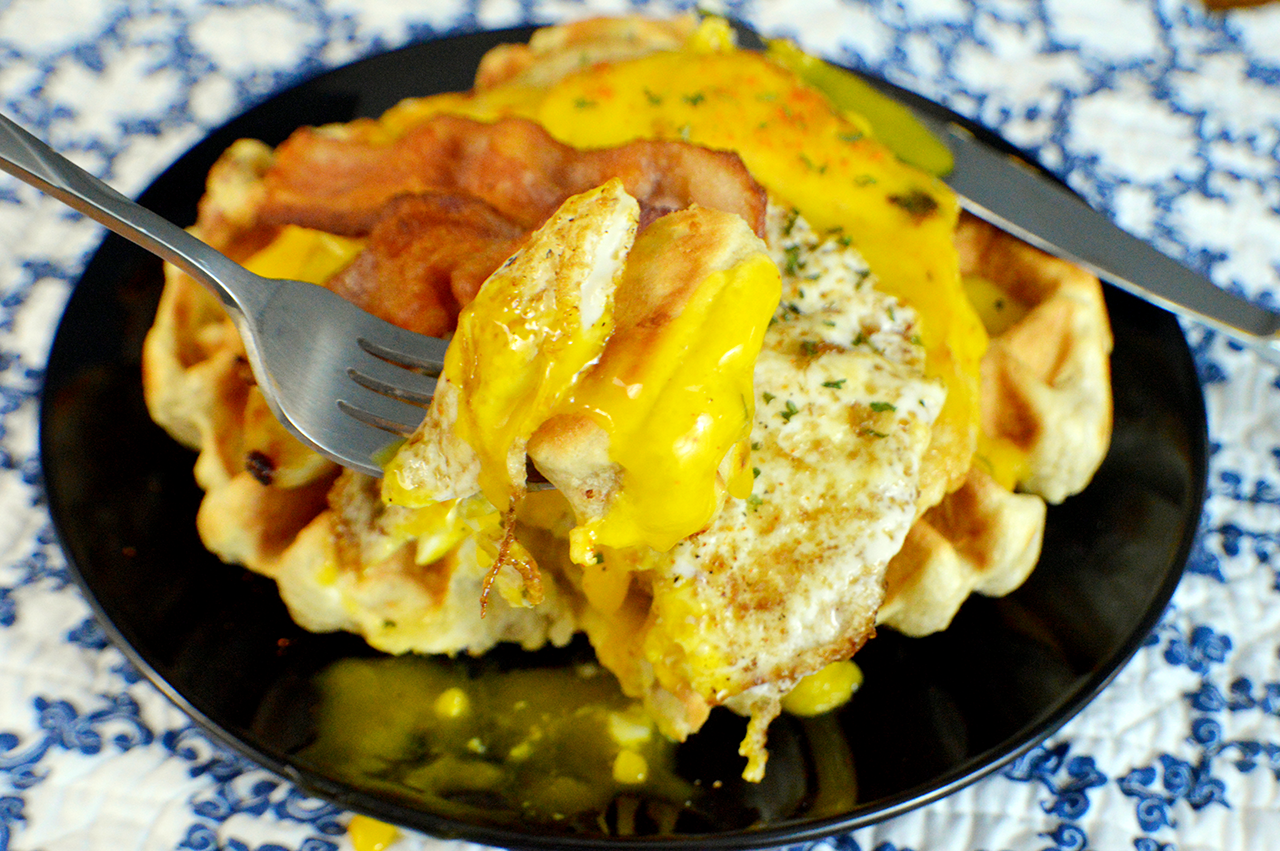 chicken waffles with eggs on top