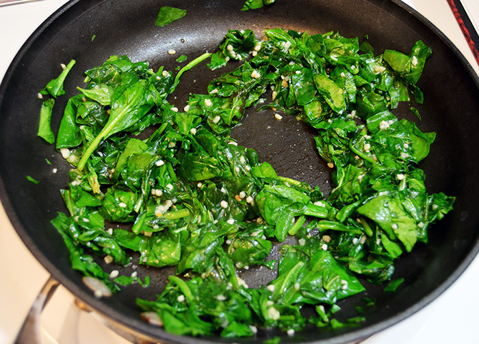 spinach and garlic in a skillet