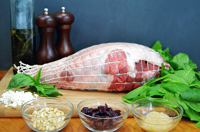 a leg of lamb with other ingredients like pine nuts and raisins