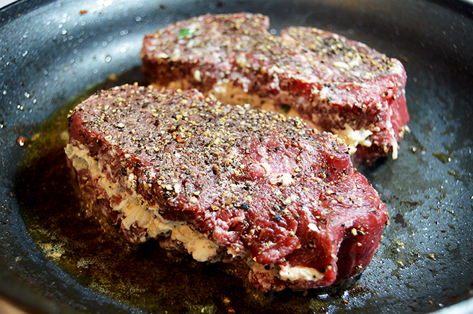 searing steaks with scallop filling