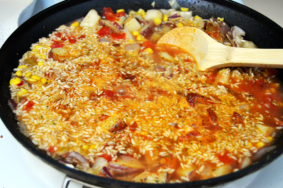 simmering in skillet with rice