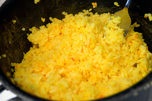saffron rice being fluffed