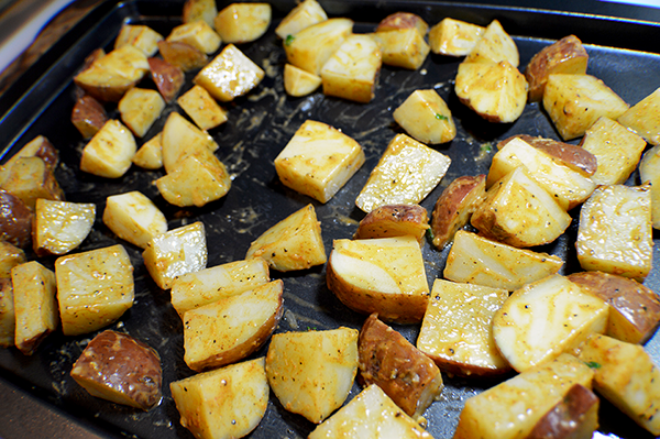 softened potatoes on a baking sheet