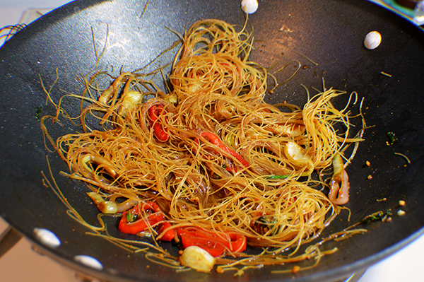 rice noodles in wok with veggies