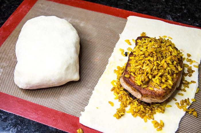 pork chops with saffron rice in puff pastry