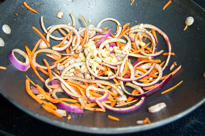 sauting veggies in wok