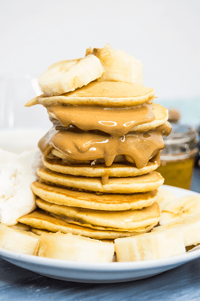 stacked pancakes with peanut butter